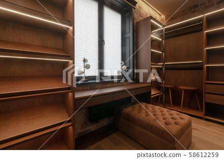 Wooden furniture in room with window Wooden furniture in room with window 58612259