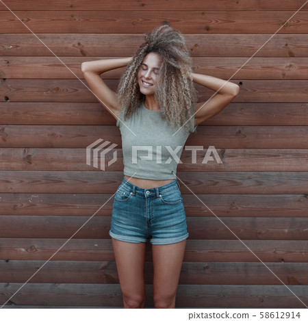 Funny happy hipster woman with curly hair  58612914