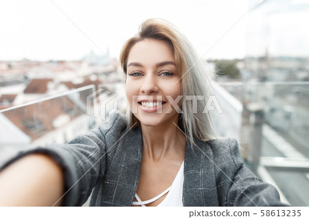 Beautiful happy young stylish woman with smile Beautiful happy young stylish woman with smile 58613235