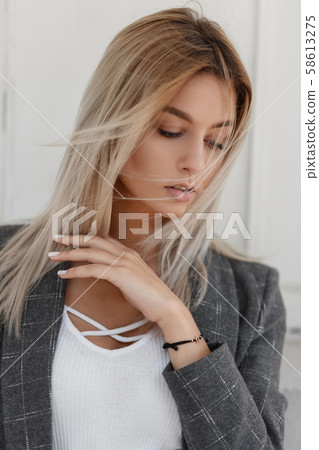 Fashionable portrait of a beautiful young blonde girl 58613275