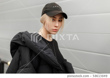 Fashion portrait of a stylish beautiful young girl Fashion portrait of a stylish beautiful young girl 58613849