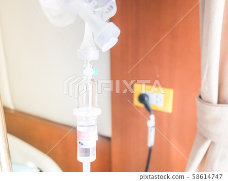 patient in hospital with saline intravenous (iv), saline into the body for treatment 58614747