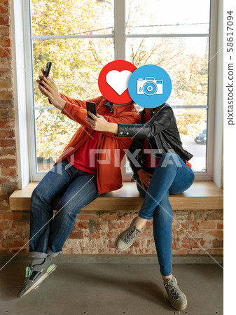 Creative millenial people connecting and sharing social media. Modern UI icons as heads Creative millenial people connecting and sharing social media. Modern UI icons as heads 58617094