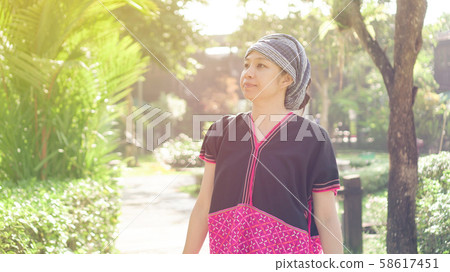 Asian ethnic woman with native dress smile at her 58617451