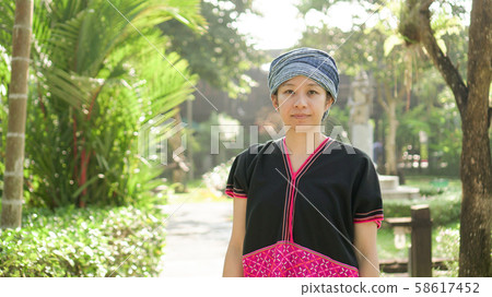 Asian ethnic woman with native dress smile at her 58617452