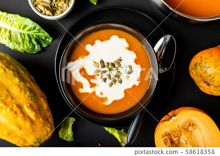 Pumpkin cream soup and vegatables. Close-up. 58618358
