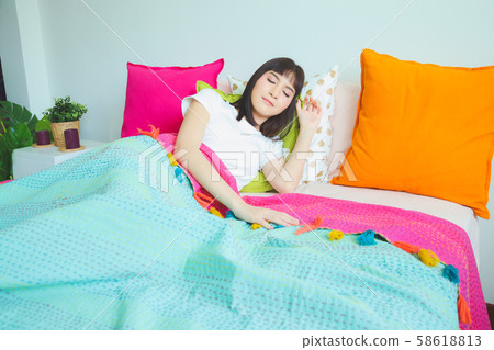 Closeup portrait of a cute young woman sleeping on Closeup portrait of a cute young woman sleeping on 58618813