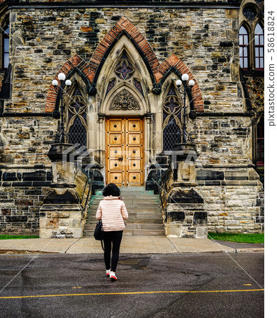 Woman walking at old town Woman walking at old town 58618824