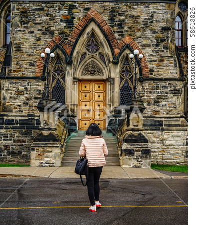 Woman walking at old town Woman walking at old town 58618826