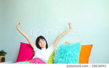 Attractive young woman wake up in morning. Cute Attractive young woman wake up in morning. Cute 58618941