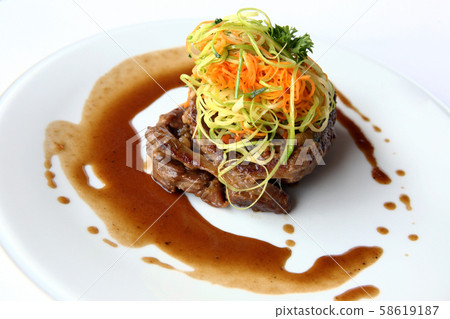 Stylish decoration of pork dish. 58619187
