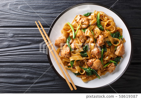 Stir fry of noodles with chicken, Chinese broccoli Stir fry of noodles with chicken, Chinese broccoli 58619387