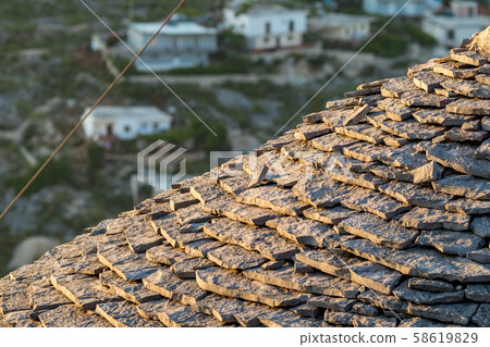 Round stone tile roof, Saranda, Albania 58619829