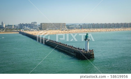 The port of Le Havre with pier and sea beach on a The port of Le Havre with pier and sea beach on a 58619956
