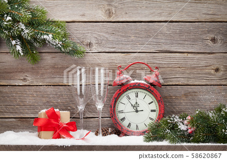 Christmas alarm clock and fir tree branch 58620867