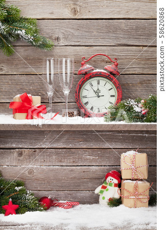 Christmas alarm clock and fir tree branch Christmas alarm clock and fir tree branch 58620868