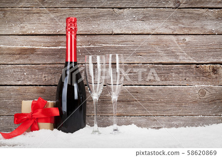 Christmas card with champagne and gift box 58620869