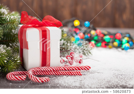 Christmas gift box, candy canes and tree Christmas gift box, candy canes and tree 58620873