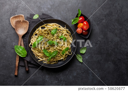 Spaghetti pasta with pesto sauce 58620877