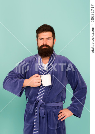 Bearded man in bathrobe with mug. Breakfast 58621717
