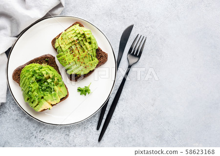 Sandwich with avocado and rye bread 58623168