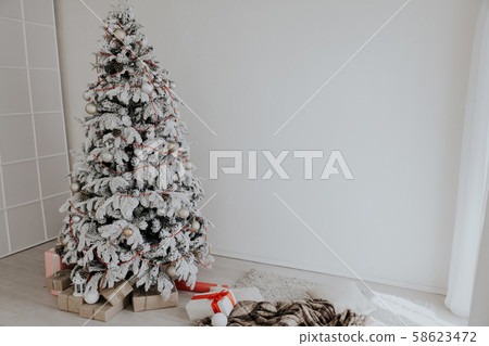Christmas tree white interior room new year gifts holidays 58623472