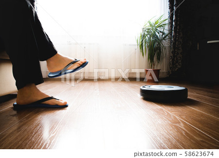 Smiling Young Couple Sitting On Sofa Watching Smiling Young Couple Sitting On Sofa Watching 58623674