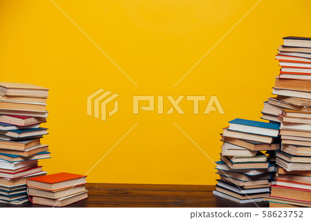 stacks of educational books university library background 58623752