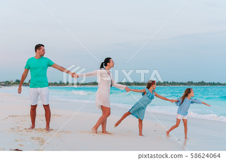 Happy family on the beach during summer vacation 58624064
