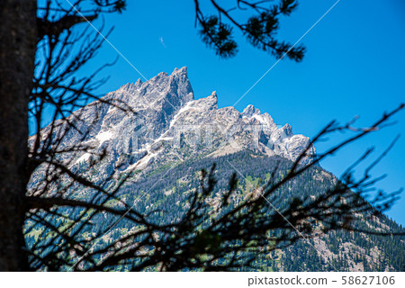 Peak of th Grand Teton by Jenny lake 58627106
