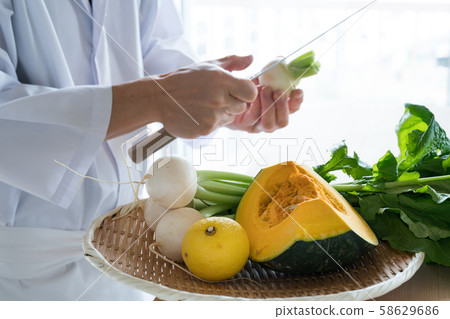 In front of the board to prepare vegetables 58629686