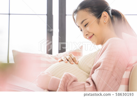 Pregnant woman lifestyle reading 58630193