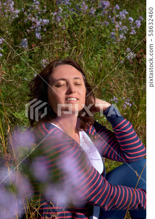 Face portrait of a girl in the park 58632460