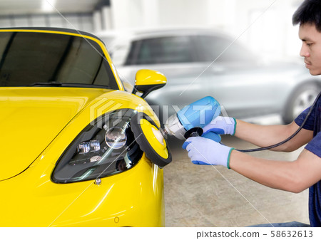 Car headlights with power buffer machine at service station - a series of CAR CARE images. Car headlights with power buffer machine at service station - a series of CAR CARE images. 58632613