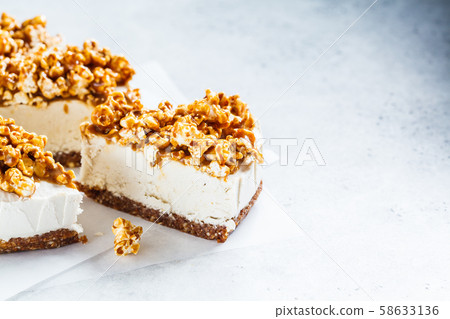 Raw vegan cashew cheesecake with caramel popcorn. 58633136