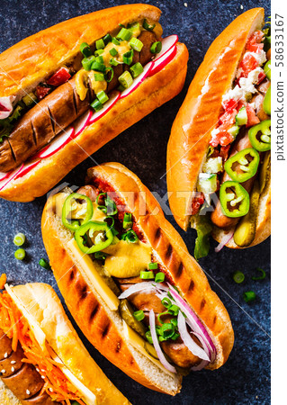 Hot dogs with different toppings  58633167