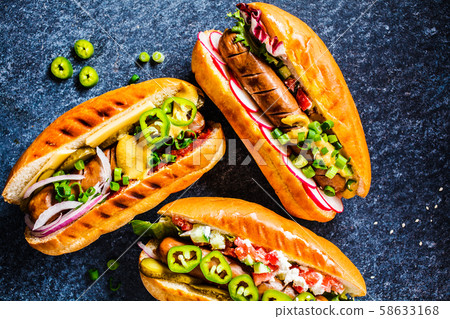 Hot dogs with different toppings  58633168