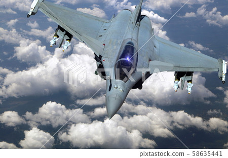 Military jet fighter flying above clouds Military jet fighter flying above clouds 58635441