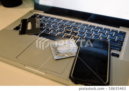 condom on laptop condom on laptop 58635463