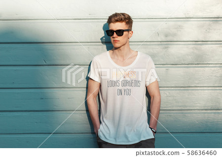 Stylish young man with sunglasses Stylish young man with sunglasses 58636460