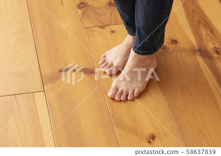 Wood floor and young woman's feet up Wood floor and young woman's feet up 58637839