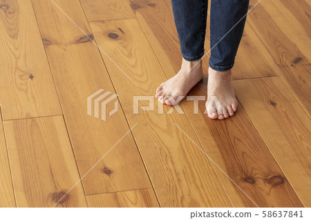 Wood floor and young woman's feet up Wood floor and young woman's feet up 58637841