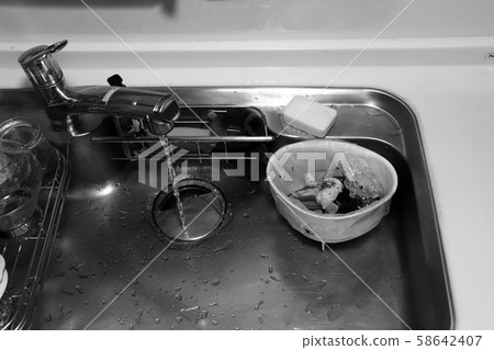 Garbage discarded in a triangular corner (monochrome) Garbage discarded in a triangular corner (monochrome) 58642407