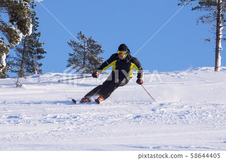 Skier in mountains 58644405