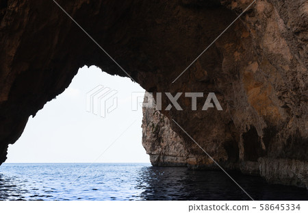Cave in coastal rock. Blue Grotto Cave in coastal rock. Blue Grotto 58645334