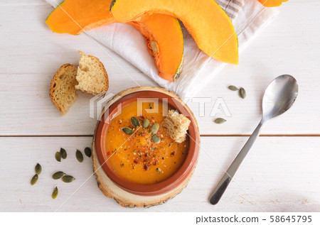 Pumpkin soup with pumpkin seeds  58645795
