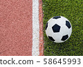 The football is near the line on the artificial 58645993
