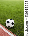 The football is on the artificial grass soccer 58645995