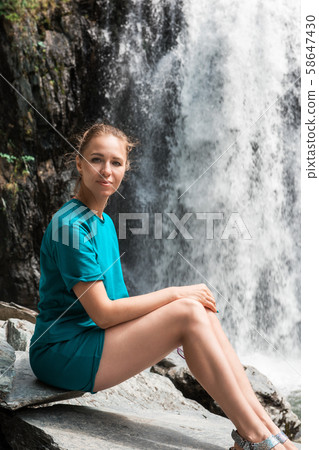 Woman at Korbu Waterfall 58647430
