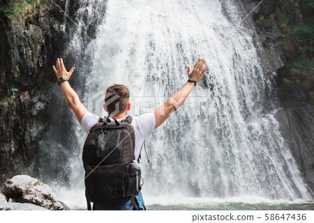 Man at Korbu Waterfall 58647436
